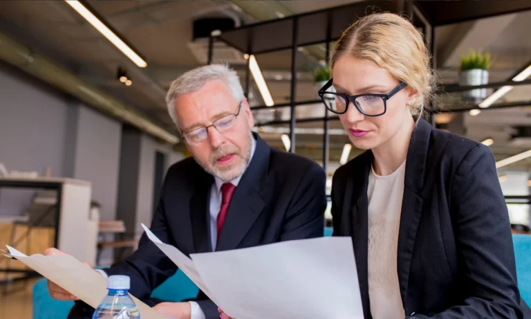 Discussion of a new business plan by businessman and businesswoman